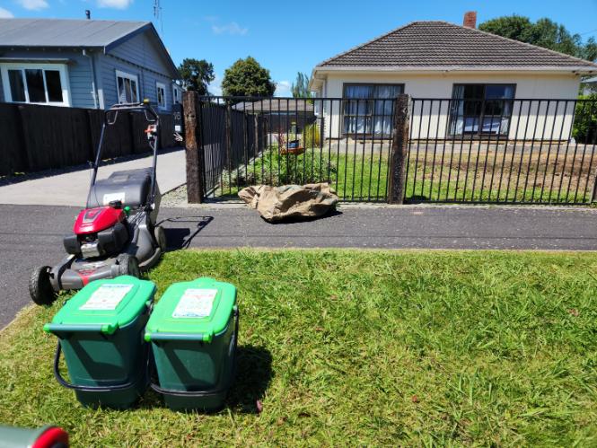Front lawn and street berm mowed at a Waihi property