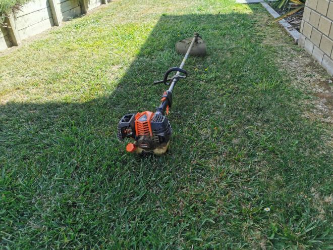 Line trimmer used to edge along a fence line at a Waihi property